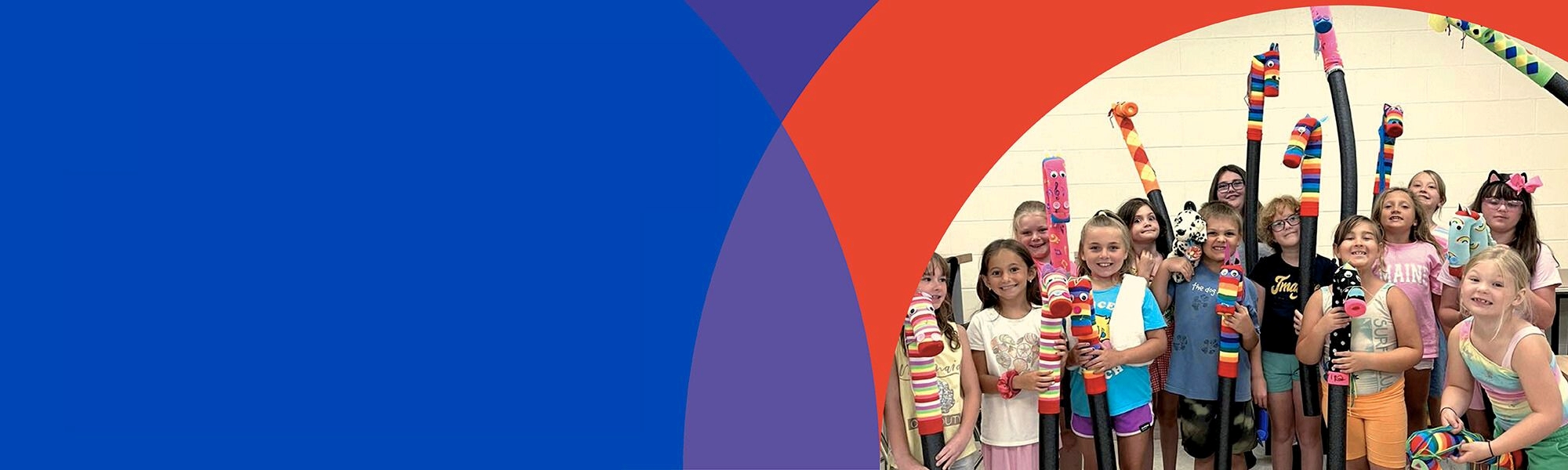 children with artwork celebrating Giving Tuesday