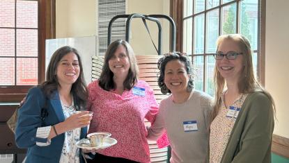 four women standing together